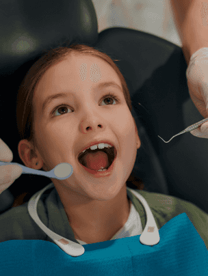 MJ pediatric dentist - child in a dental office